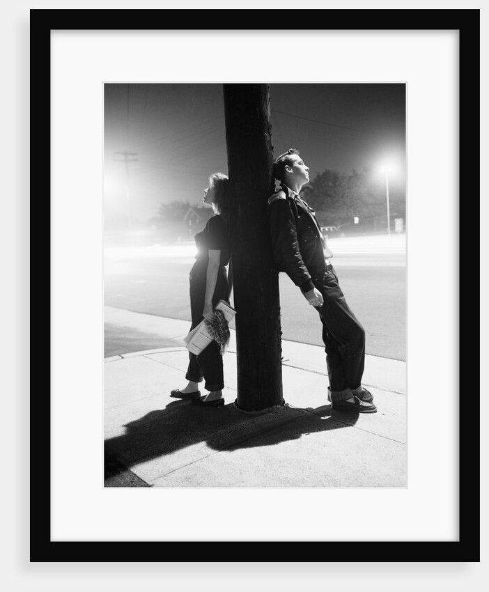 Teenagers Leaning on Utility Pole by Anonymous
