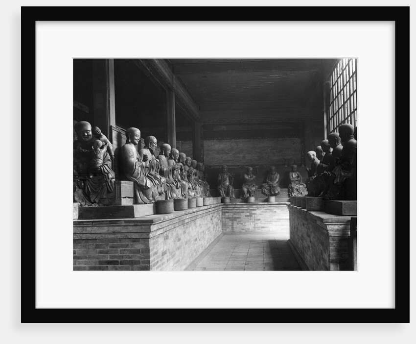 Chinese Gods Lined In A Temple by Anonymous
