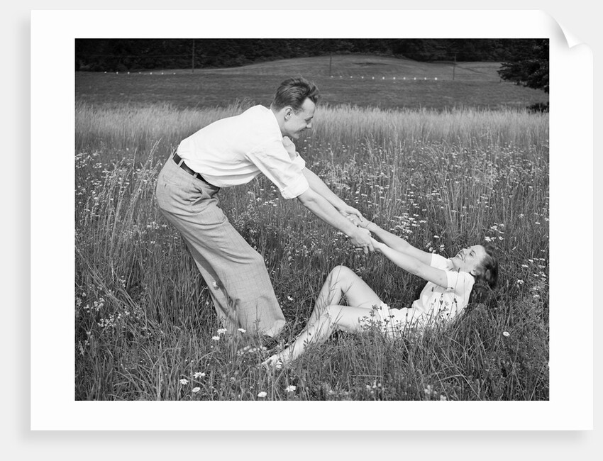 Young Couple Frolicking in Grass by Anonymous