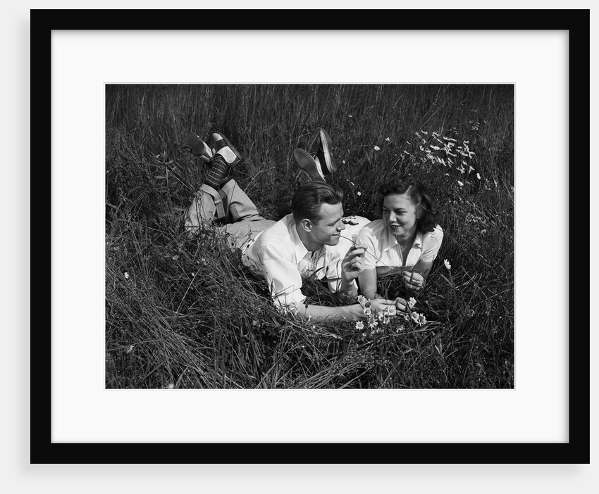 Young Couple Lying in the Grass by Anonymous