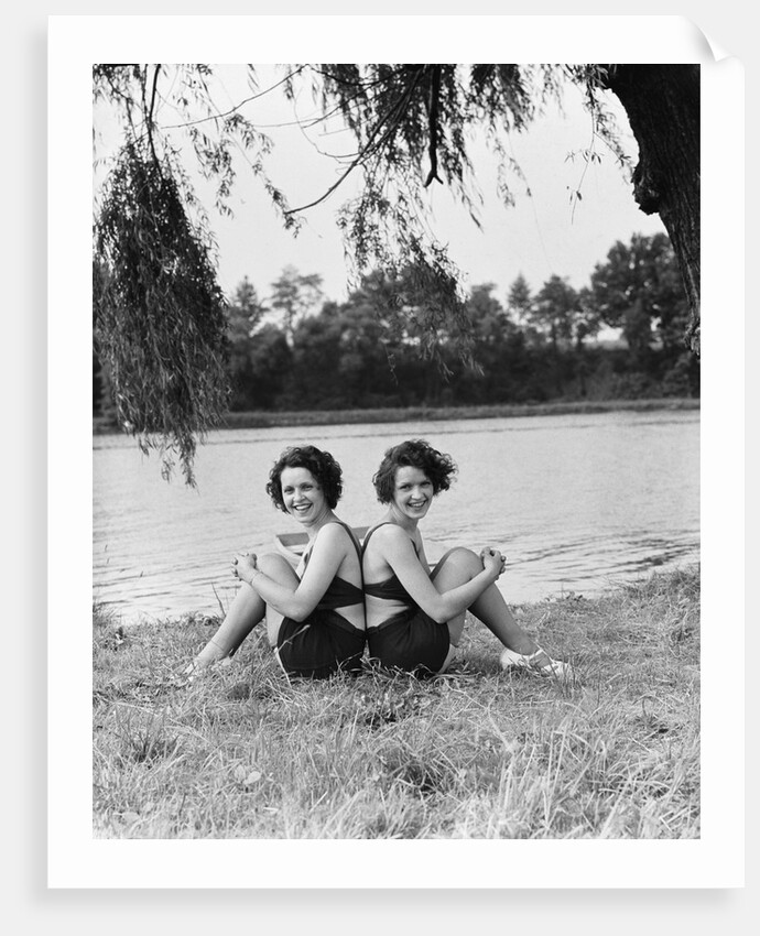 Twin Sisters Sitting Back to Back by Anonymous
