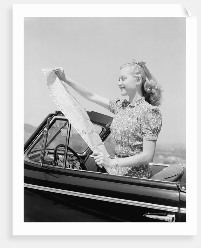 Young Woman Reading Road Map by Anonymous