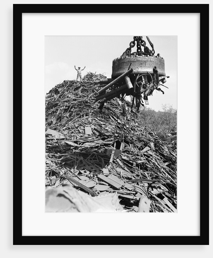 Huge Magnet Picking Up Scrap Metal by Anonymous