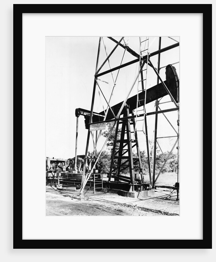 Oil Derrick Pumping Closer Up by Anonymous