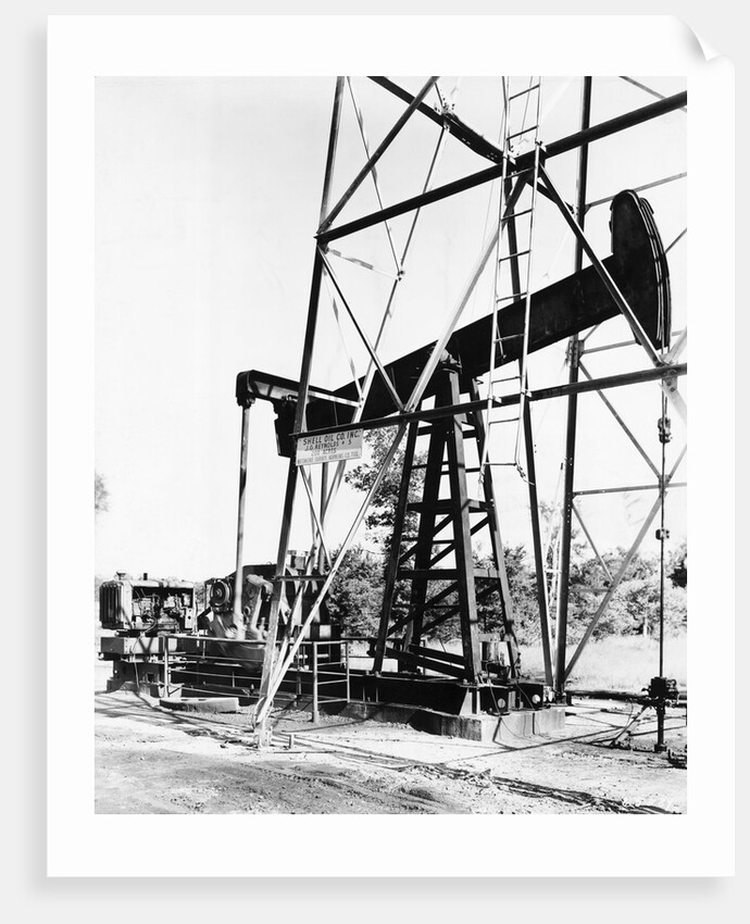 Oil Derrick Pumping Closer Up by Anonymous