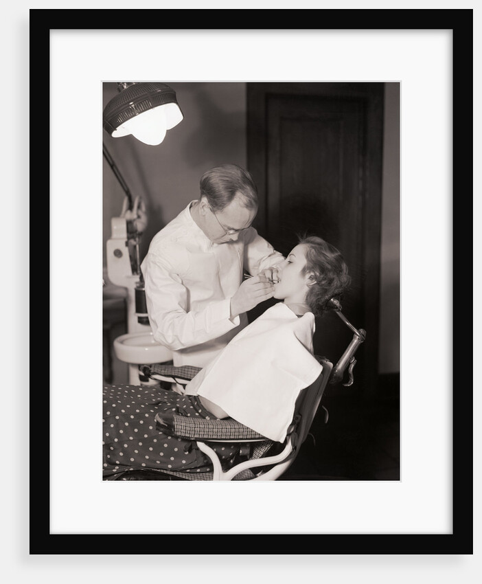 Dentist Examining Patients Teeth by Anonymous