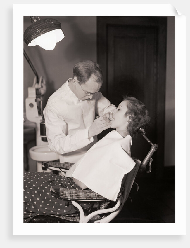 Dentist Examining Patients Teeth by Anonymous