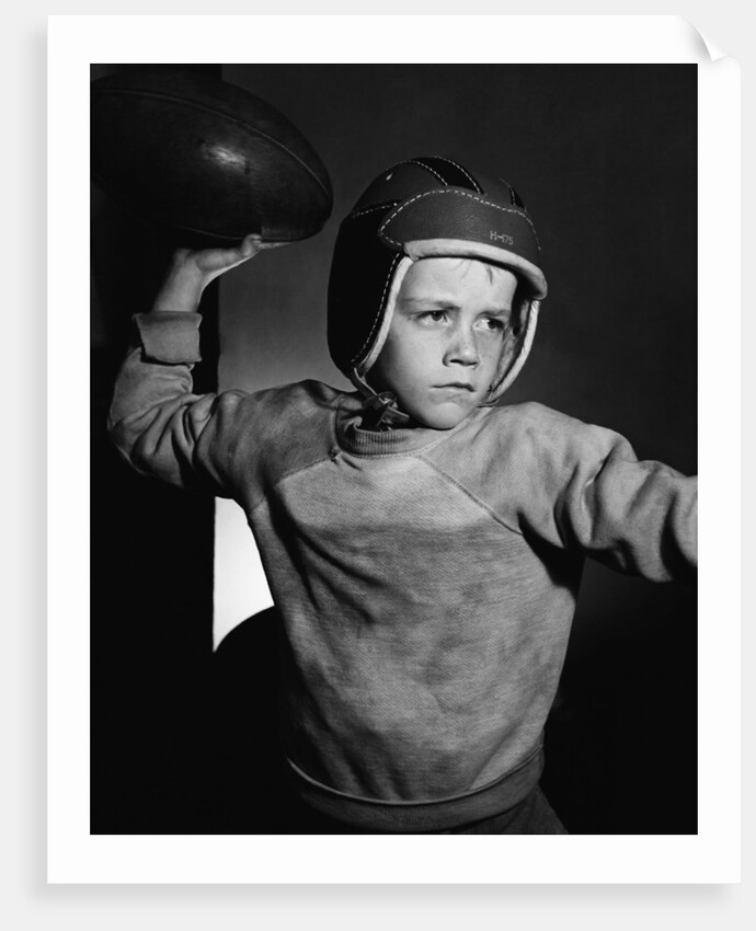 Boy Throwing a Football by Anonymous