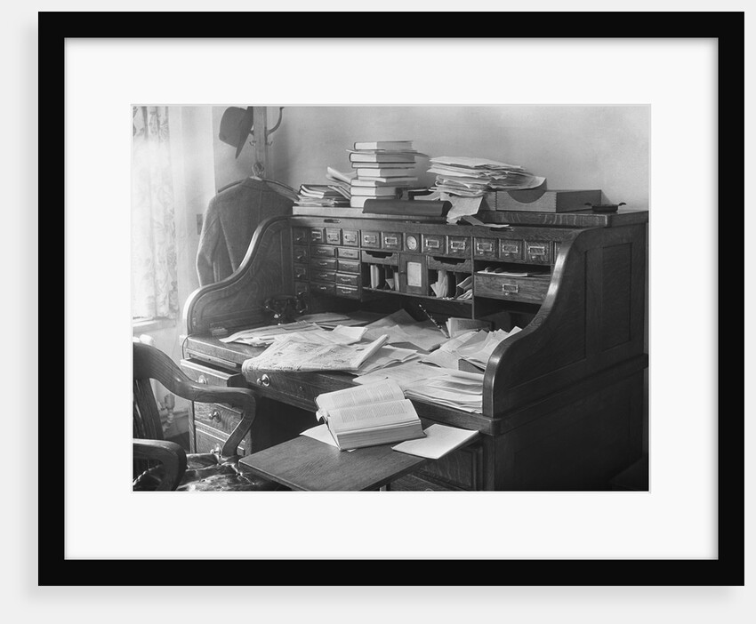 Rolltop Desk Littered with Books and Papers by Anonymous