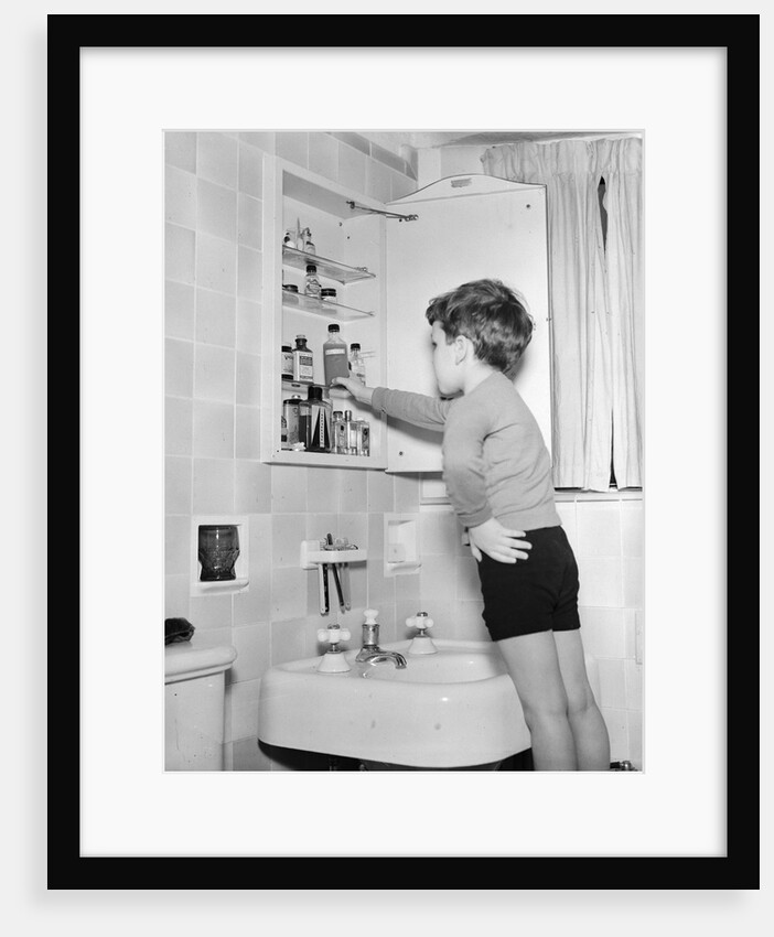 Boy Reaching into Medicine Cabinet by Anonymous
