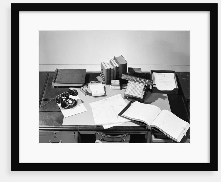 Desk Covered with Assorted Office Supplies by Anonymous