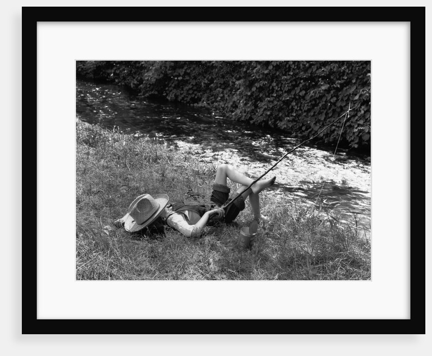 Boy Fishing with Hat Over Face by Anonymous