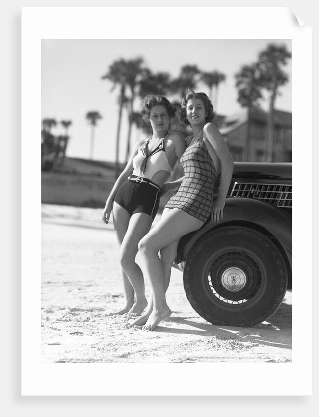 Women in Bathing Suits Leaning Against Car by Anonymous