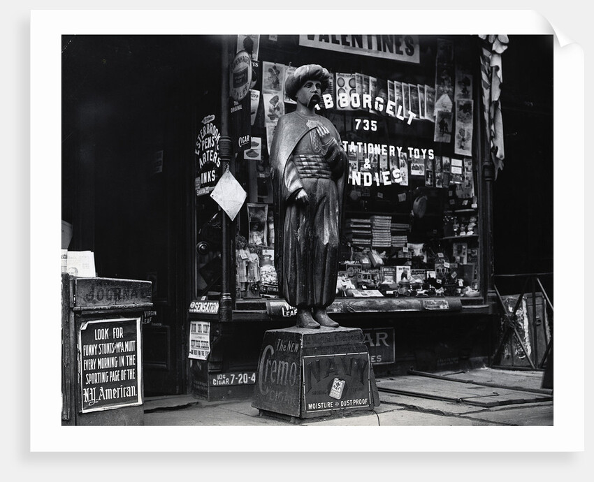 Wooden Statue In Front Of Shop Window by Anonymous