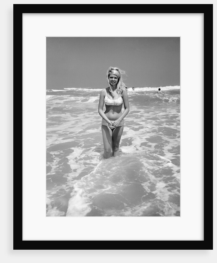Woman Standing in Ocean Surf by Anonymous