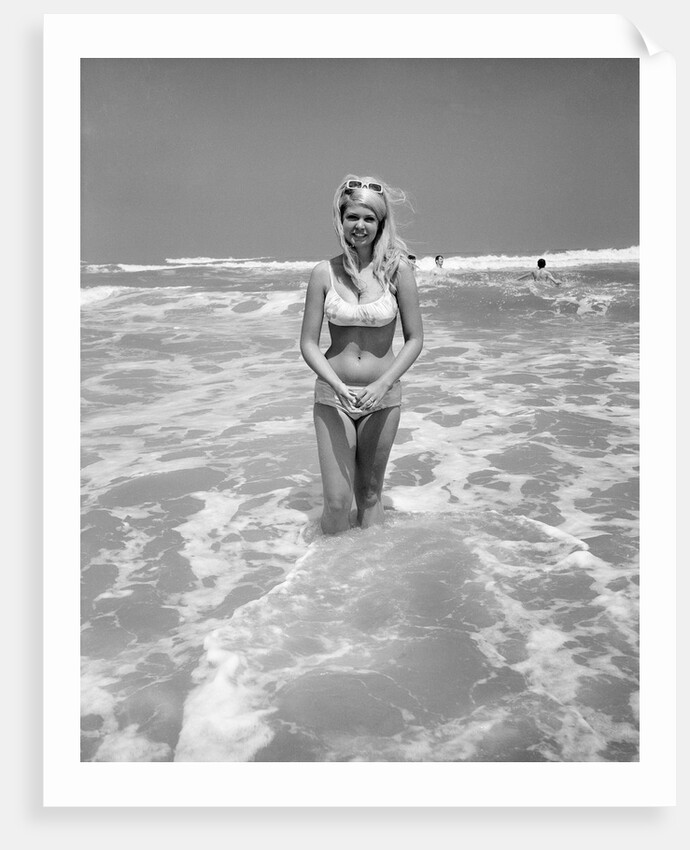 Woman Standing in Ocean Surf by Anonymous