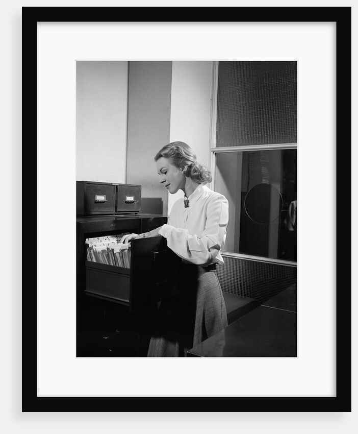 Woman and File Cabinet by Anonymous