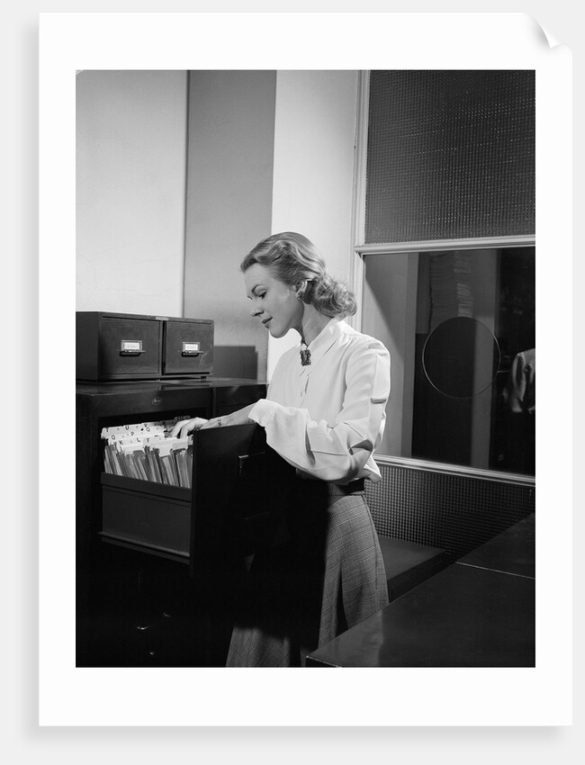 Woman and File Cabinet by Anonymous