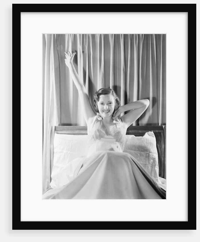 Woman Stretching in Bed by Anonymous