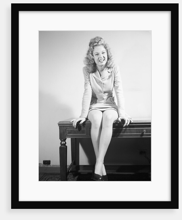 Woman Seated on Desk by Anonymous