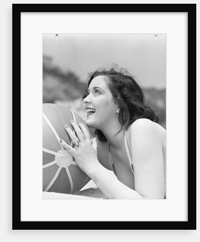 Woman Holding a Beach Ball by Anonymous