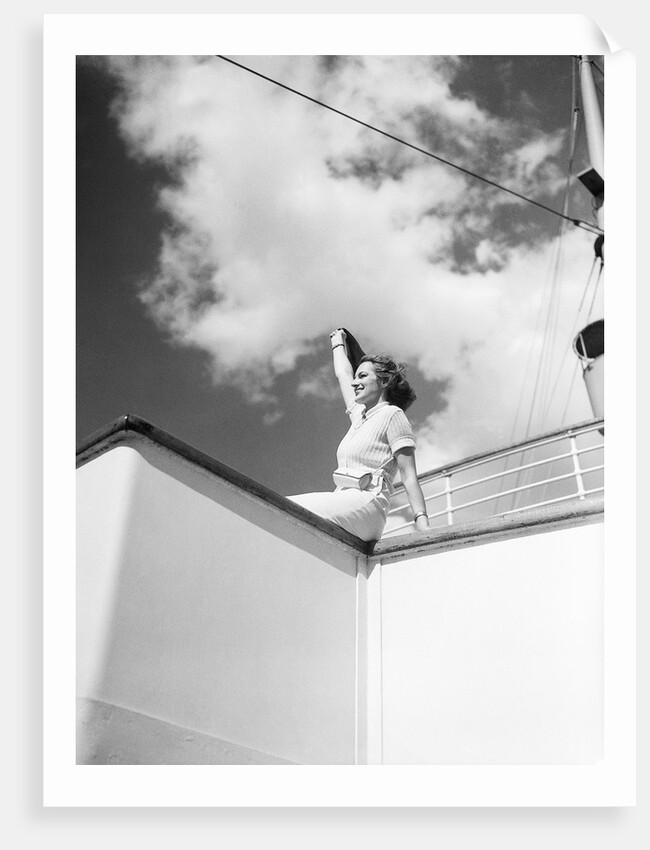 Woman Sitting on Ship Railing by Anonymous