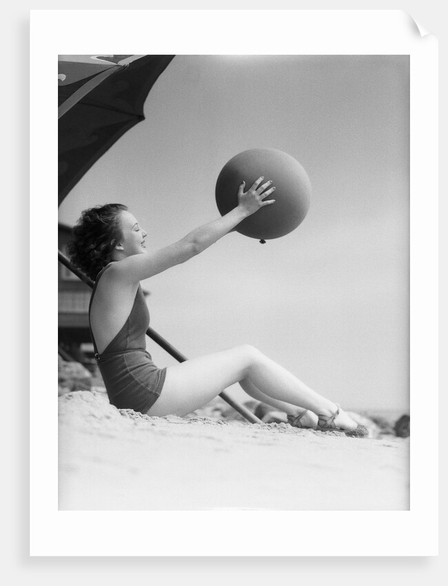 Young Woman Playing With Beach Ball by Anonymous