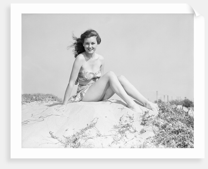 Young Woman Seated on Sand Dune by Anonymous