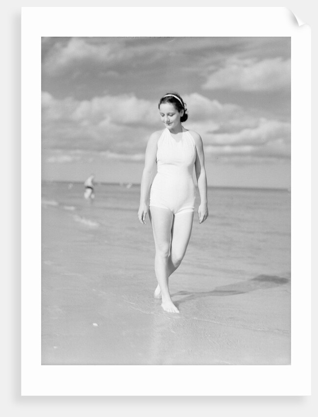 Woman Casually Strolling Along the Beach by Anonymous