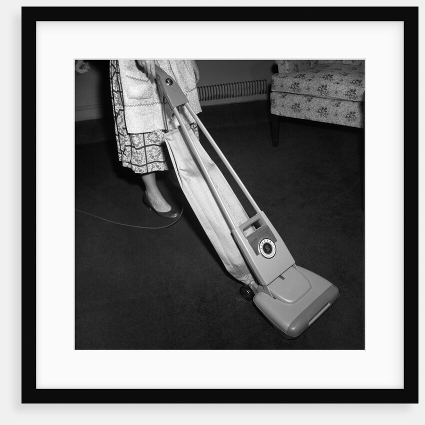 Woman Vacuuming by Anonymous