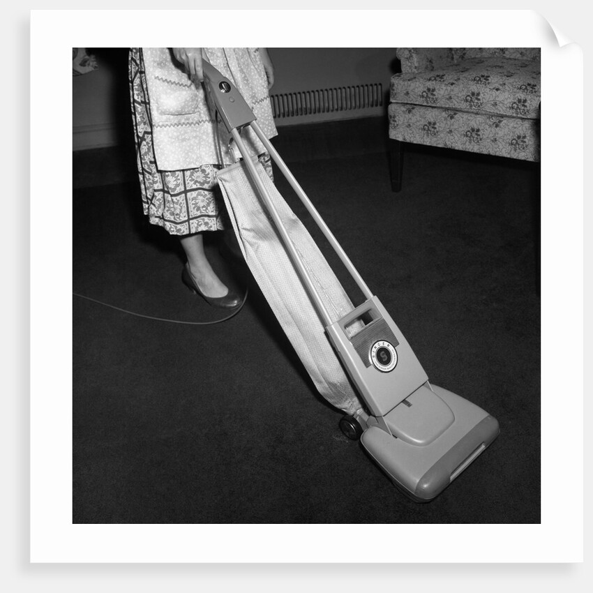 Woman Vacuuming by Anonymous