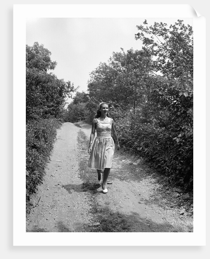 Woman Walking on Country Road by Anonymous