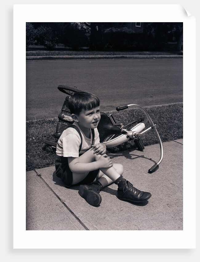 Boy Fallen Off Tricycle and Holding Knee by Anonymous