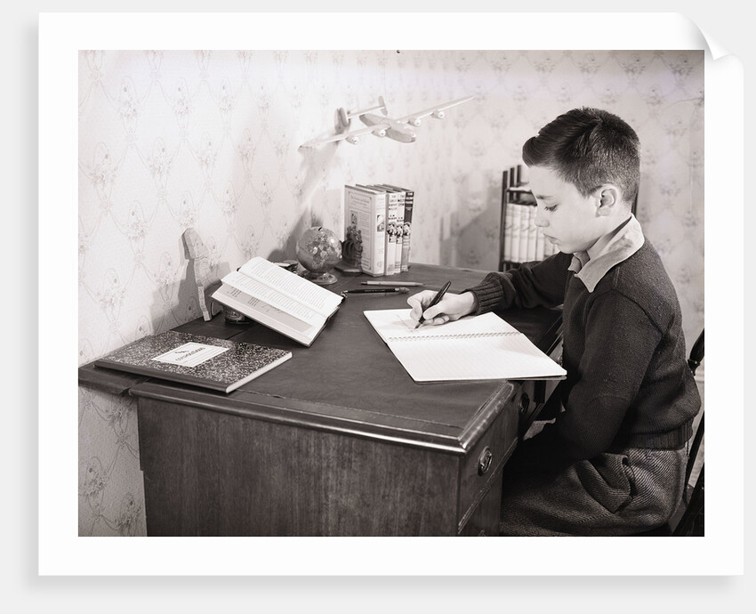 Boy Writing at Desk by Anonymous