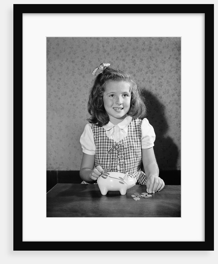 Girl Putting Money In Piggy Bank by Anonymous