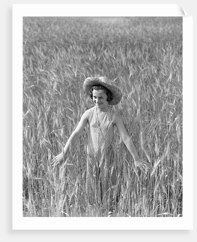 Girl Standing in Wheat Field by Anonymous