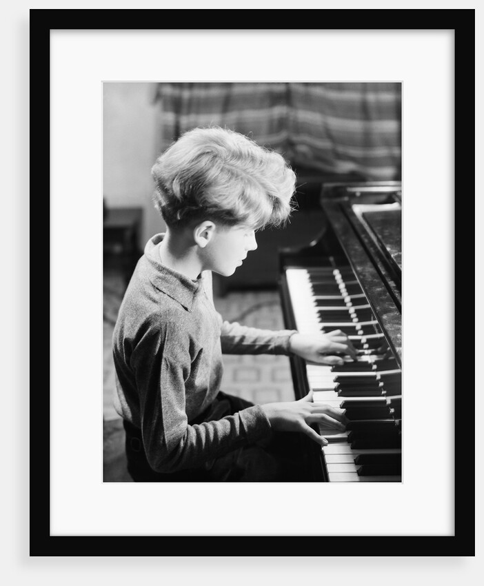 Boy Practicing Piano by Anonymous