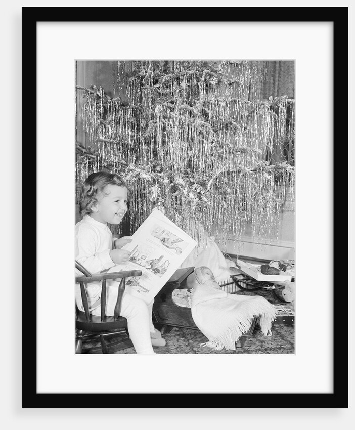 Girl Sitting Beside Christmas Tree by Anonymous