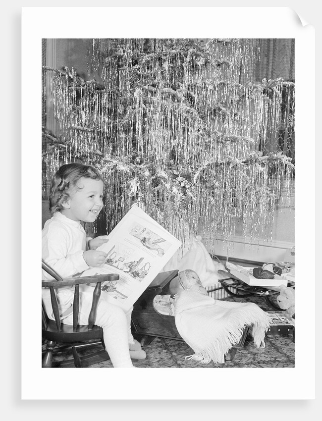 Girl Sitting Beside Christmas Tree by Anonymous