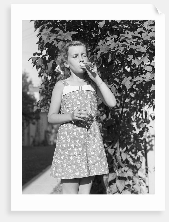 Girl Blowing Soap Bubbles by Anonymous