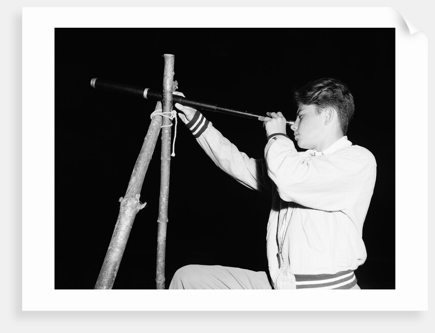 Boy Looking Through a Telescope by Anonymous