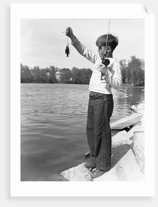 Boy Holding a Small Fish by Anonymous
