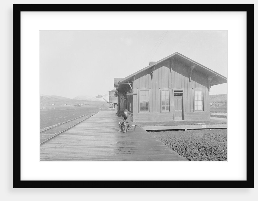 Man Waiting at Railroad Station by Anonymous