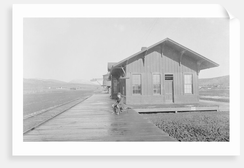 Man Waiting at Railroad Station by Anonymous