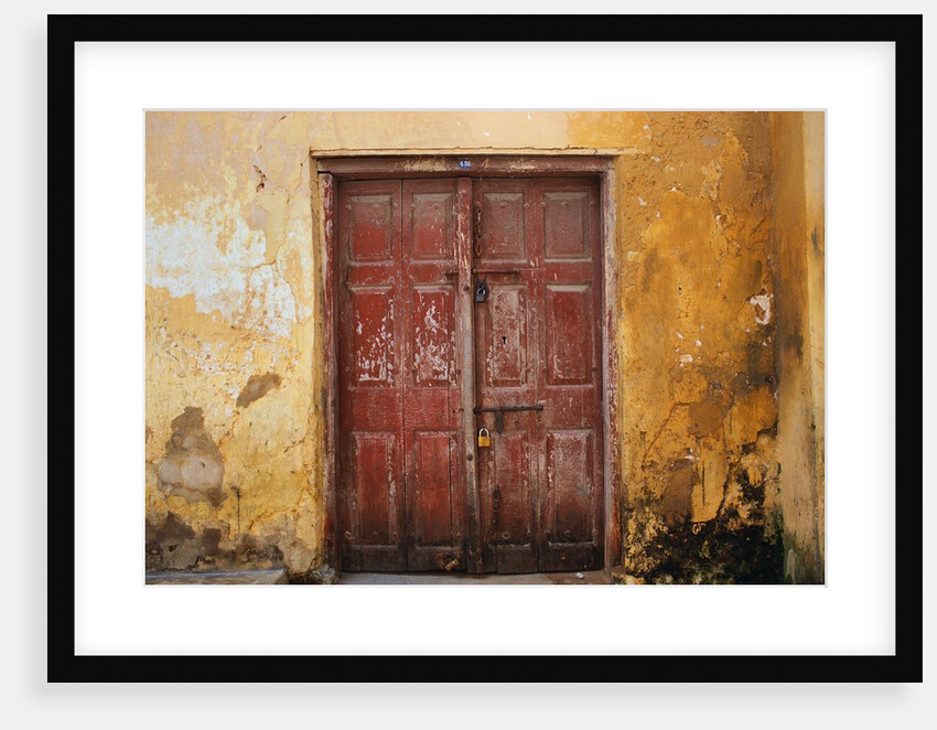 Wooden Door in Worn Wall by Anonymous