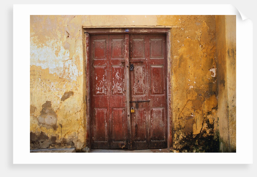 Wooden Door in Worn Wall by Anonymous