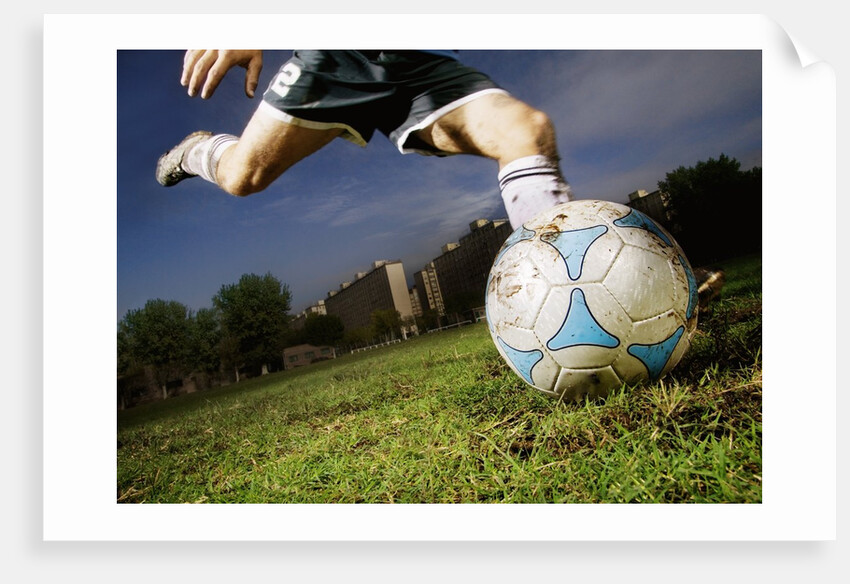 Soccer Player Kicking Ball by Anonymous