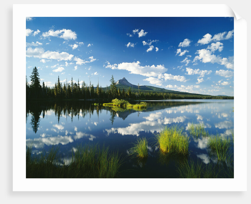 Clouds in Sky Reflected by Mountain Lake by Anonymous