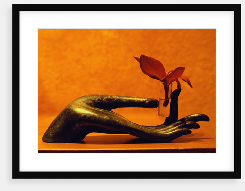 Sculpted Hand Holding Massage Oil Vial by Anonymous