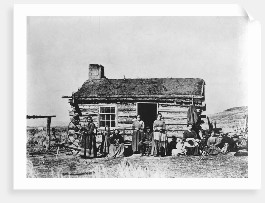 Mormon Family Outside Log Cabin by Anonymous